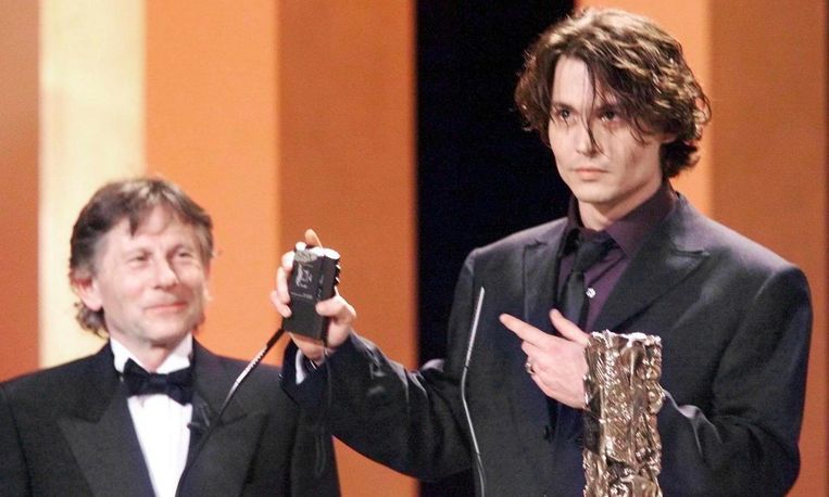 Roman Polanski samen met acteur Johnny Depp in 1999. Beeld afp