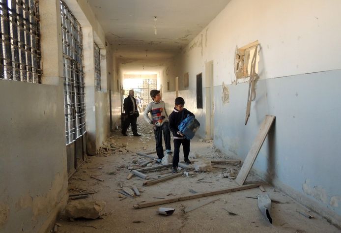 Syrische kinderen in een school in Marea na een luchtaanval in december 2013.