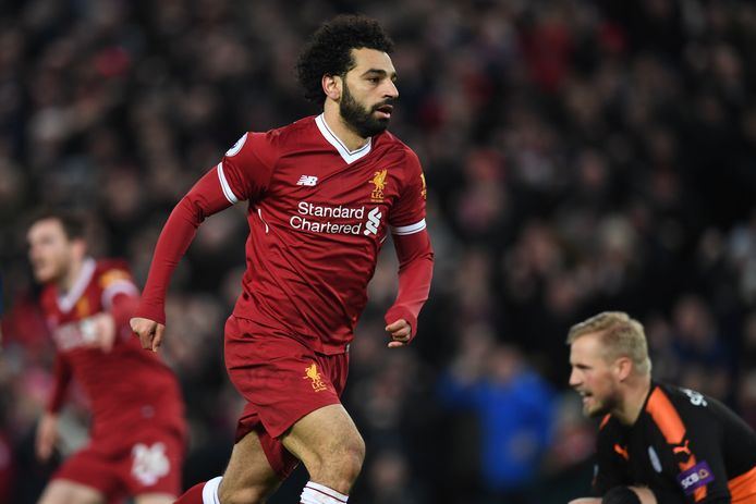 Liverpool's Egyptian midfielder Mohamed Salah celebrates scoring the team's first goal during the English Premier League football match between Liverpool and Leicester at Anfield in Liverpool, north west England on December 30, 2017. / AFP PHOTO / Paul ELLIS / RESTRICTED TO EDITORIAL USE. No use with unauthorized audio, video, data, fixture lists, club/league logos or 'live' services. Online in-match use limited to 75 images, no video emulation. No use in betting, games or single club/league/player publications.  /