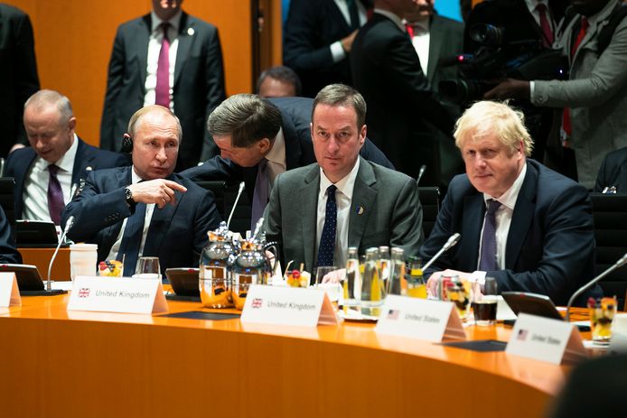 Boris Johnson en Vladimir Poetin tijdens de meeting in Berlijn.