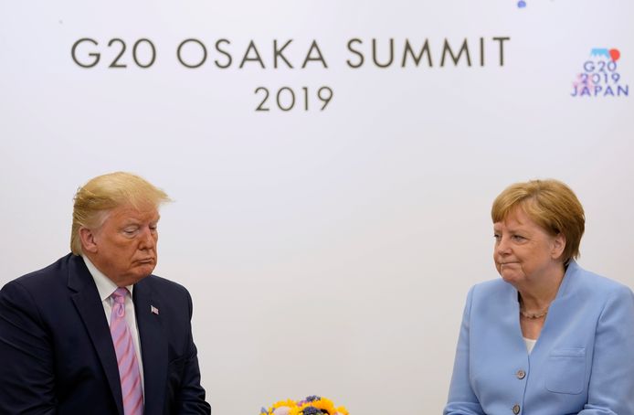 Beeld ter illustratie, de Amerikaanse president Donald Trump en de Duitse bondskanselier Angela Merkel.