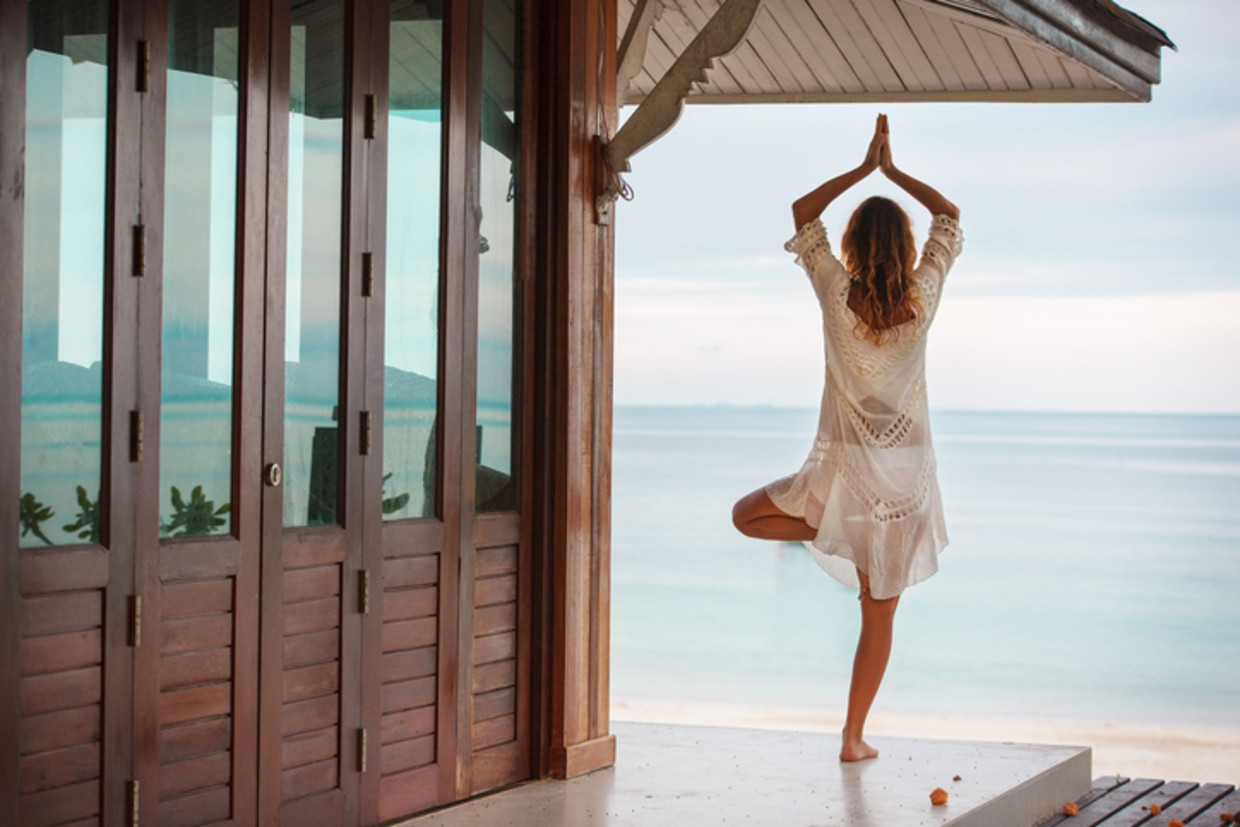 Yoga op een exotische locatie: het is een van de populairste reisformules voor 2018. Beeld Thinkstock