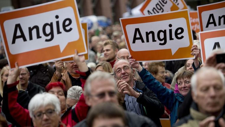 Supporters van de Duitse Bondskanselier Angela Merkel. Beeld afp
