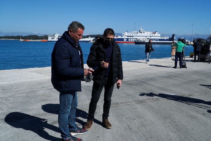 Costas Mathios and Vassilis Vergis, relatives of the missing truck drivers, in the port of Corfu.