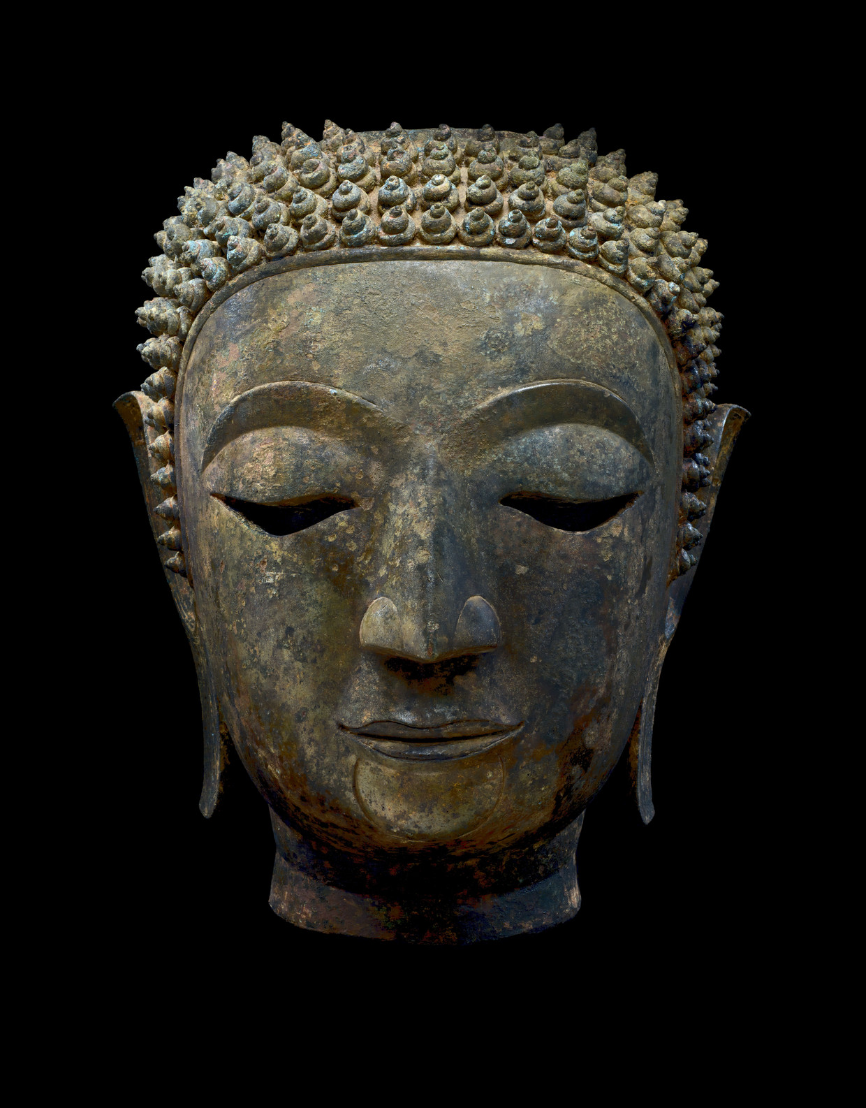 Hoofd van Boeddha Śākyamuni, Thailand, koninkrijk Lan Na, Chieng Sen, 15de eeuw. Ger Eenens Collection, The Netherlands/Wereldmuseum Rotterdam.   Beeld Erik en Petra Hesmerg