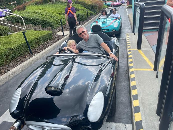 Kristoff and Lisa Marie on a ride in Autopia.