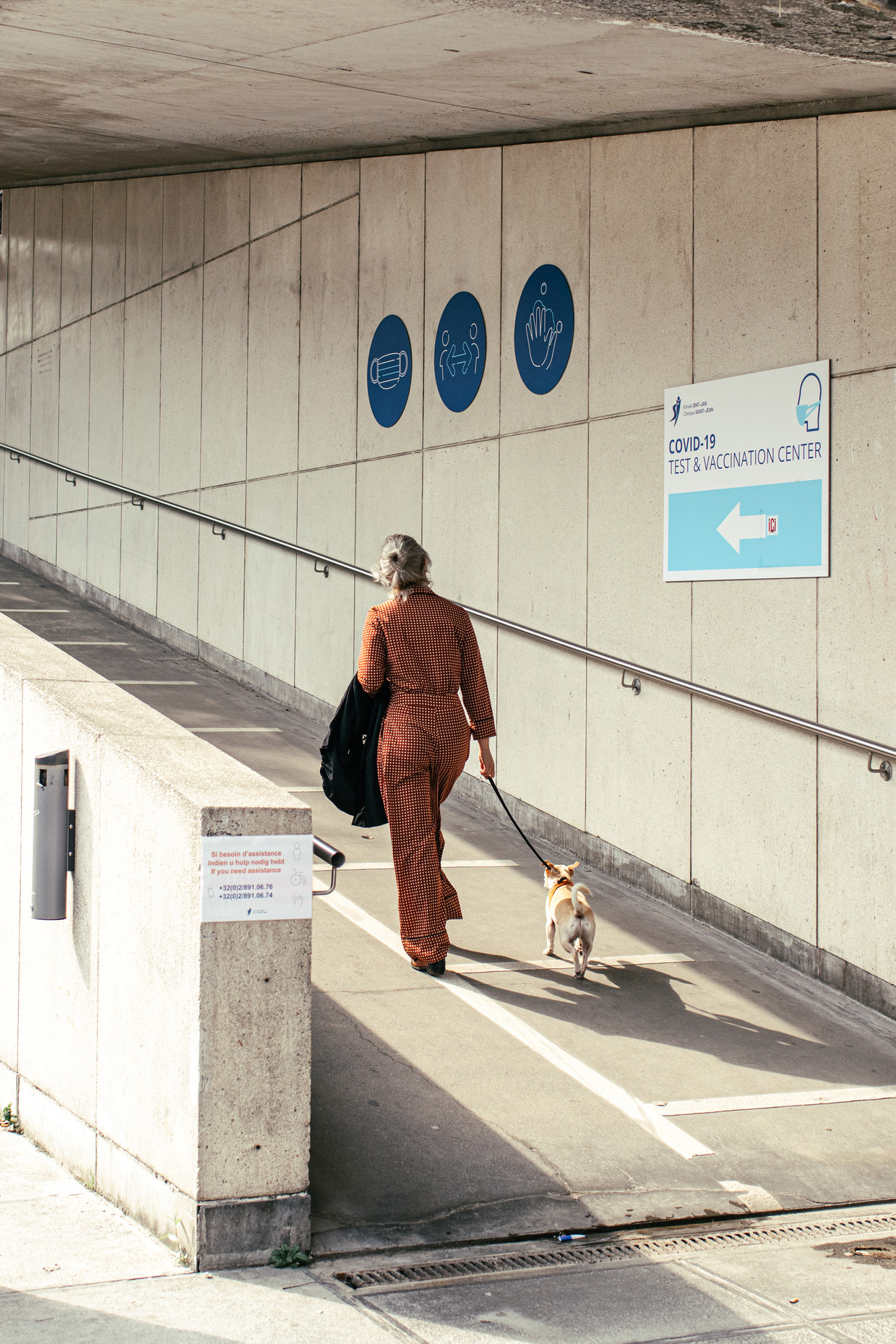 This woman walks to a test center in the heart of Brussels.  Tyne Shoemaker Statue