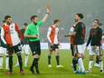 Scheidsrechter Edwin van de Graaf geeft NEC-verdediger Iván Márquez een rode kaart in de wedstrijd tegen Feyenoord.