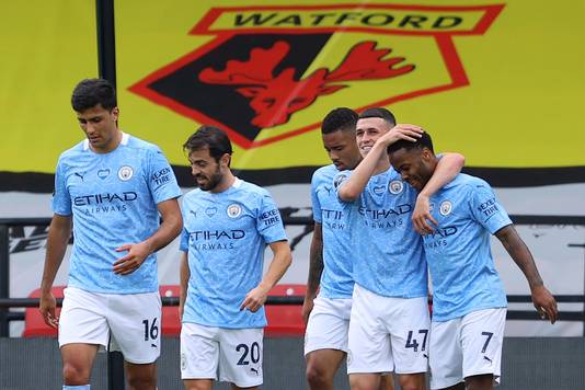 Manchester City's English midfielder Raheem Sterling (R) celebrates scoring his team's second goal with Manchester City's English midfielder Phil Foden during the English Premier League football match between Watford and Manchester City at Vicarage Road Stadium in Watford, north of London on July 21, 2020. (Photo by Richard Heathcote / POOL / AFP) / RESTRICTED TO EDITORIAL USE. No use with unauthorized audio, video, data, fixture lists, club/league logos or 'live' services. Online in-match use limited to 120 images. An additional 40 images may be used in extra time. No video emulation. Social media in-match use limited to 120 images. An additional 40 images may be used in extra time. No use in betting publications, games or single club/league/player publications. /