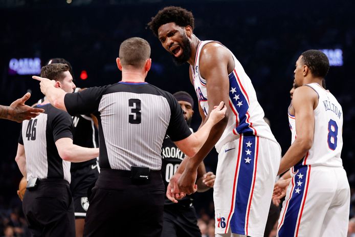 Joel Embiid in discussion with the referee