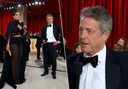 Ashley Graham en Hugh Grant op de Oscars