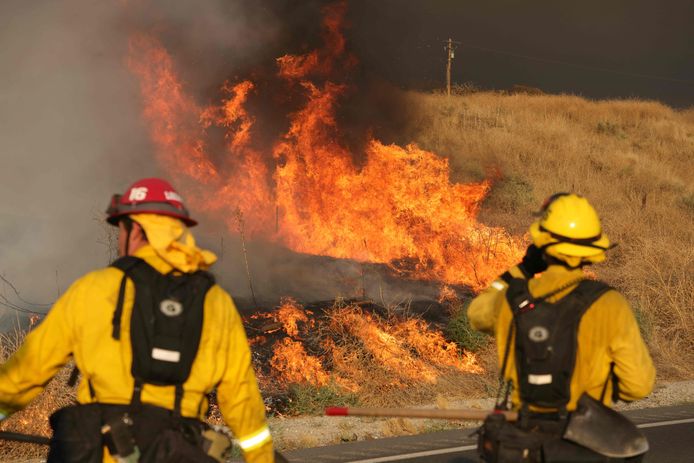 Firefighters battle wildfires in California's Moreno Valley.