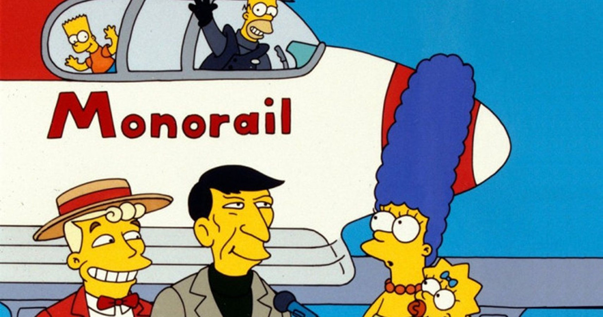 Zoon Bart en vader Homer in de Monorail, rechts vooraan moeder Marge en dochter Lisa: The Simpsons. Beeld 