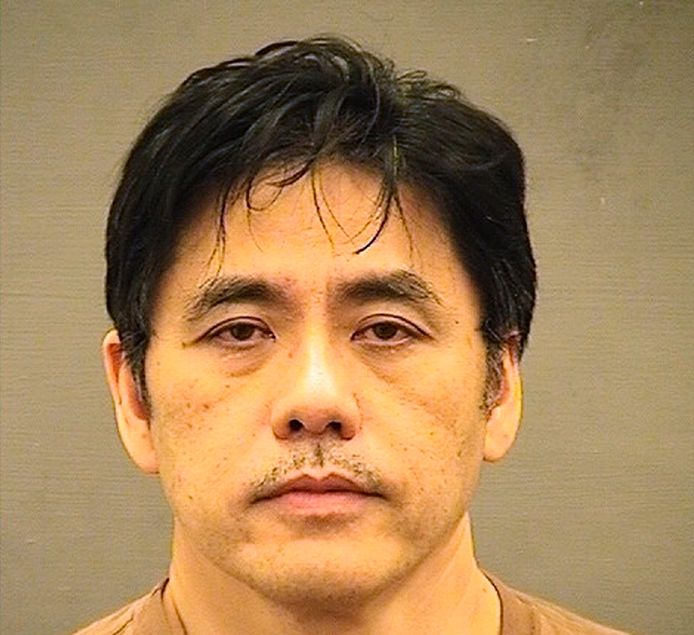 Een politiefoto van Jerry Chun Shing Lee na zijn arrestatie. Hij riskeert een celstraf van 21 jaar tot levenslang. Twee Chinese agenten haalden hem in 2010 over om CIA-informatie door te spelen.