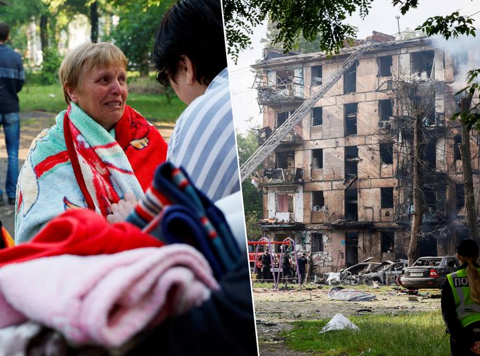 Bewoners reageren na de raketaanval op hun appartementsgebouw in Kryvyi Rih.