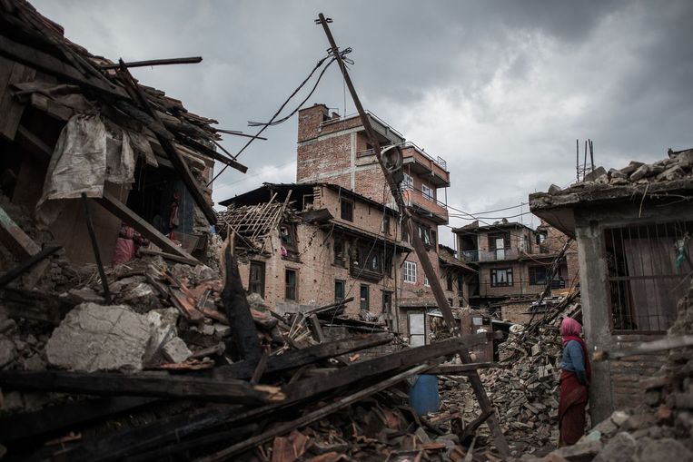 Verwoeste gebouwen in het historische dorp Khokana. Beeld afp