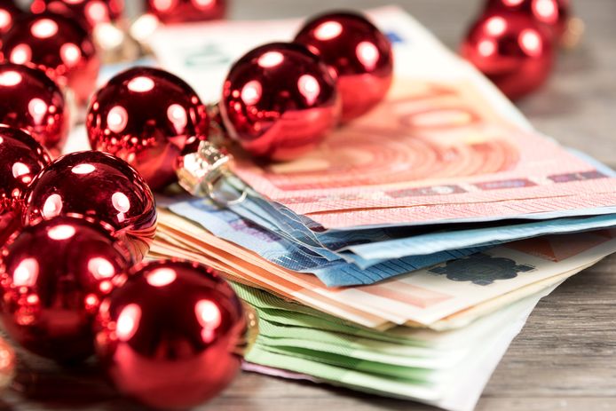 Euro banknotes and Christmas balls; Shutterstock ID 510611668; purchase_order: HLN; job: HLN; client: HLN; other: