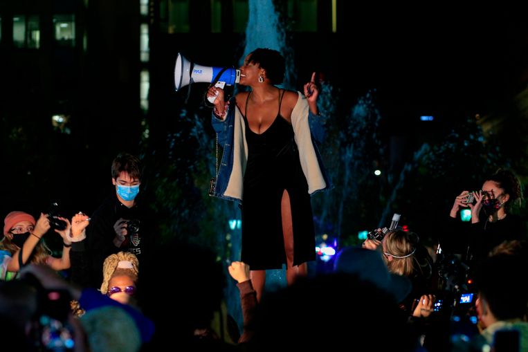 A woman gives a speech at a 'Donald Trump is Over Party' in Washington Square Park, New York.  Image AFP