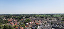 Wouw met op de achtergrond Roosendaal, gezien vanaf de toren van de Lambertuskerk