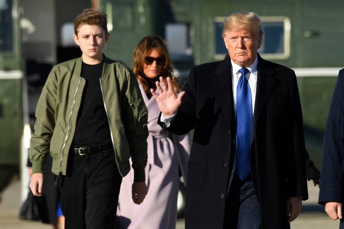 Zoon Barron Trump (L), first lady Melania Trump (Midden) en president Donald Trump (R).