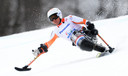 Kees Jan van der Klooster in actie op de Super G op de Paralympics in Sotsji.