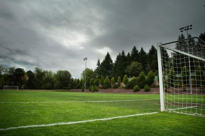 Grass soccer/football field on a cloudy day