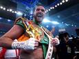 Tyson Fury celebrates after beating Britainâ€™s Dillian Whyte to win their WBC heavyweight title boxing fight at Wembley Stadium in London, Saturday, April 23, 2022. (Nick Potts/PA via AP)