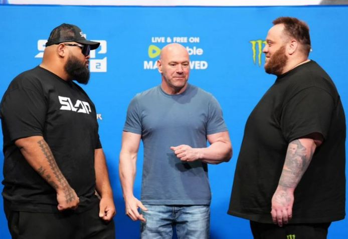 Viernes (left) vs. Hutchinson, with promoter Dana White in the middle.