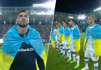 Spelers van Dinamo Kiev stappen met Oekaïense vlag om de schouders het veld op: “Hier zijn eigenlijk amper woorden voor”
