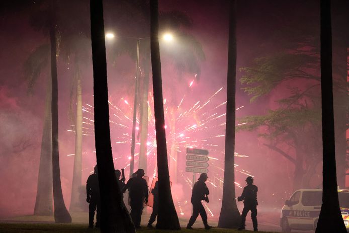 Fireworks explode during clashes between rioters and police at Le Port in La Reunion, a French overseas territory east of Madagascar.  Rather, the wave of protests in France spread there.