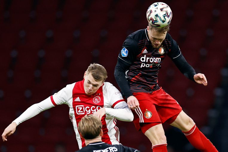 Ajax' Perr Schuurs en Nicolai Jörgensen van Feyenoord. Beeld ANP