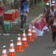 ‘Te vermoeid en te glibberig’: Franse marathonloper die flesjes water van tafel duwde, komt met verklaring