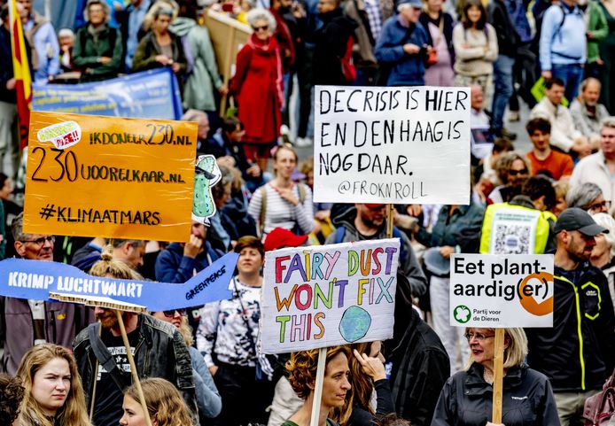 Participants in the climate march gather on the Binnenrotte square in front of the Markthal Rotterdam.