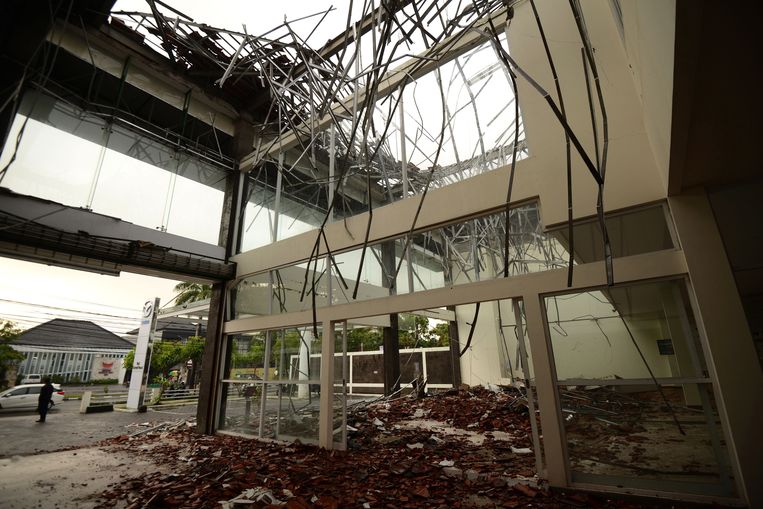 Schade aan een winkel op Bali. Beeld AFP