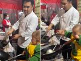 Peuter van 15 maanden imiteert vader tijdens het koken