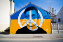 Graffiti van de Oekraïense president Volodmir Zelenski.