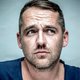 ‘Ik had acne, was nogal corpulent en droeg een bril met dikke glazen, dus riepen ze ‘puistenkop’, ‘dikzak’ of ‘blinde mol’’