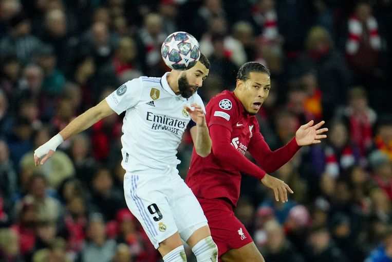 Real Madrid player Karim Benzema wins an aerial duel against Virgil van Dijk (right).  A.P.'s photo