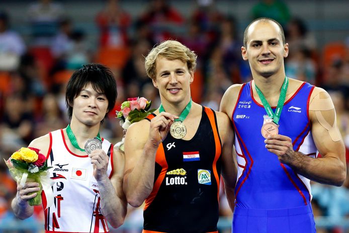 Kohei Uchimura (zilver) met Ibeki Zunderland (goud) en Korat Marigo Muznick (brons) op het WK 2014.