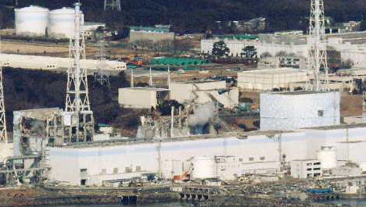 De beschadigde centrale in het Japanse Fukushima. Foto: reuters Beeld 
