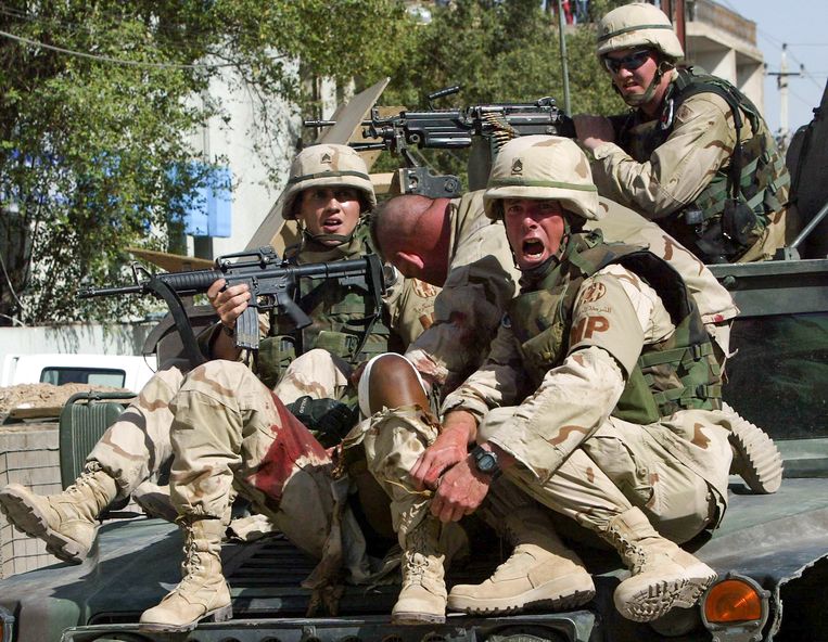 Amerikaanse soldaten in mei 2004 in Irak.  Beeld EPA