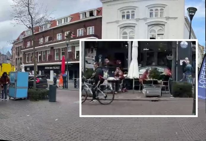 Een auto is midden op het terras van Lekker Zwols aan de Oude Vismarkt in Zwolle geparkeerd.