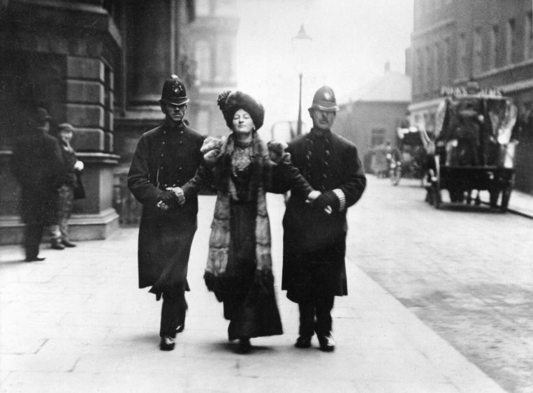 A suffragette is taken away by the police in London, April 1906. Image Getty