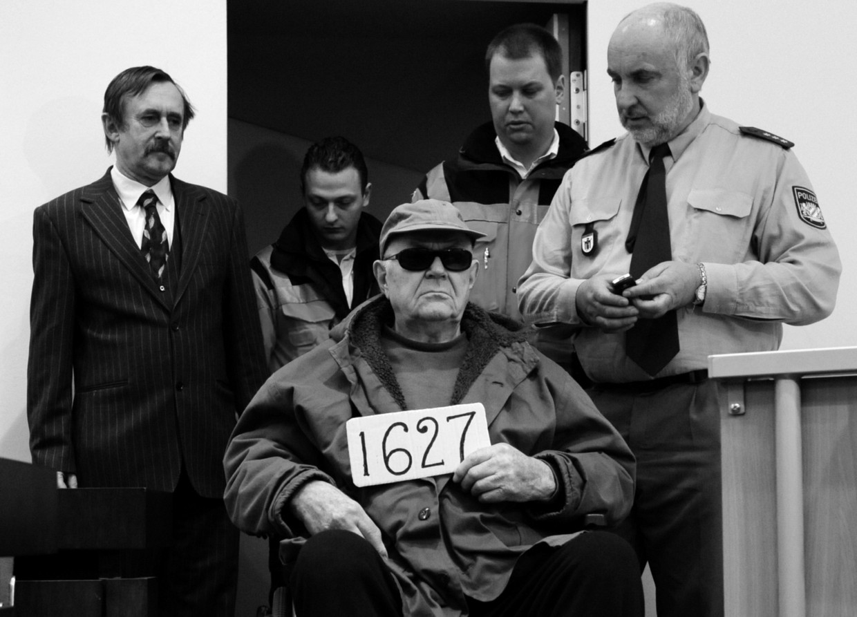 ‘John’ Demjanjuk, bewaker in Sobibor,  tijdens het proces tegen hem in München, 2011.  Beeld AP