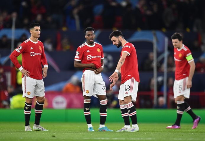 De spelers van Manchester United treuren.