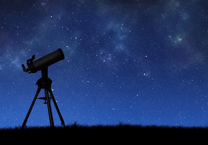 Telescope silhouette against the starry sky