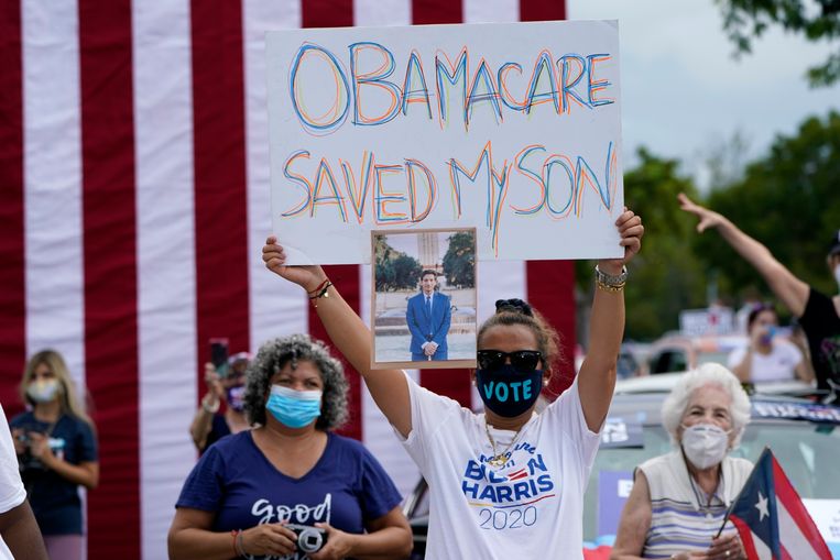 Steun voor Obamacare tijdens de campagne voor Joe Biden, oktober vorig jaar. Beeld Lynne Sladky / AP