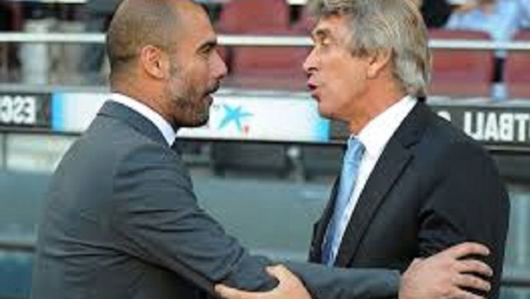 De komende en vertrekkende coach van Manchester City: Josep Guardiola en Manuel Pellegrini. Beeld Reuters