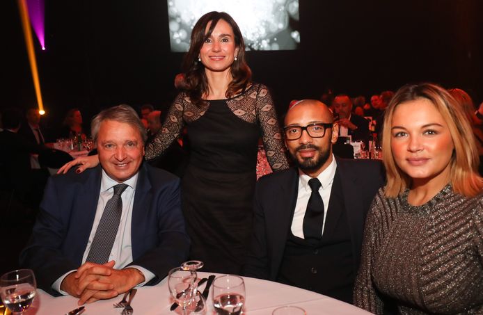 Anderlecht's manager Herman Van Holsbeeck and her wife Esmeralada and Anderlecht's team manager Gunther Van Handenhoven pictured during the fifth edition of the Gala evening 'Sport and Fashion evening', a charity gala for associations, organised by Carlo & Fils, at the Spiroudome in Charleroi with Miss Belgium candidates and players of Sporting Charleroi, Monday 20 November 2017. BELGA PHOTO VIRGINIE LEFOUR