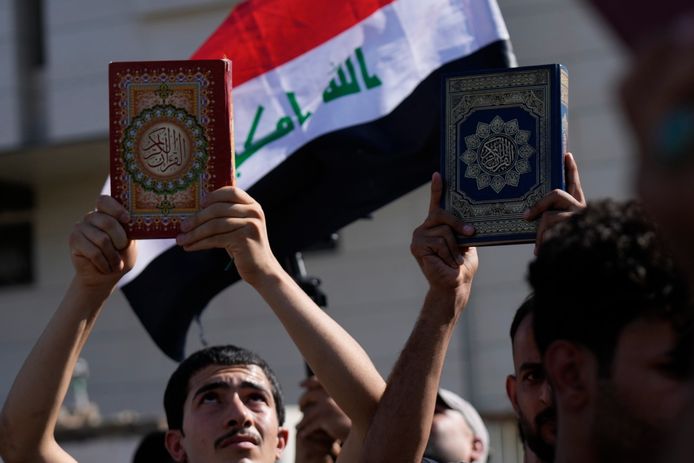 Supporters of Iraqi cleric Muqtada al-Sadr hold up Qurans at an earlier demonstration outside the Swedish embassy in Baghdad.